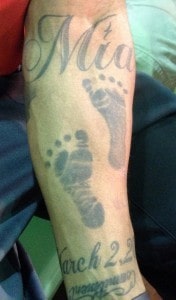 Solomon Patton has little Mia's footprints and her birthdate tattooed on his left forearm. 