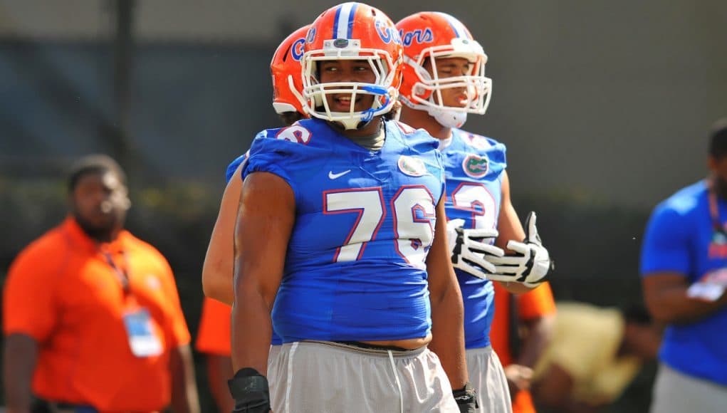 Florida Gators Max Garcia leads an offensive line on the field at University of Florida during Spring practice 2014.