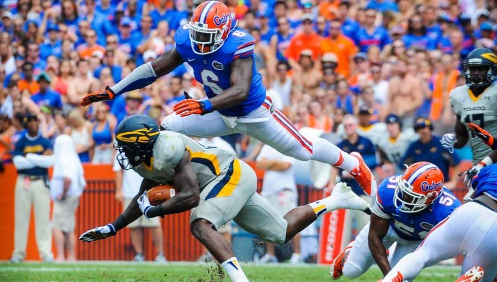 Florida Gators Football: Dominique Easley tackles opposing player on Florida Field, Gainesville, Fl