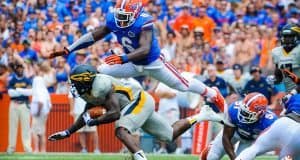 Florida Gators Football: Dominique Easley tackles opposing player on Florida Field, Gainesville, Fl