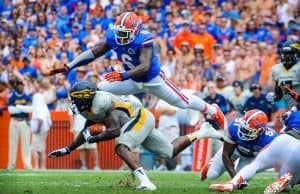 Florida Gators Football: Dominique Easley tackles opposing player on Florida Field, Gainesville, Fl