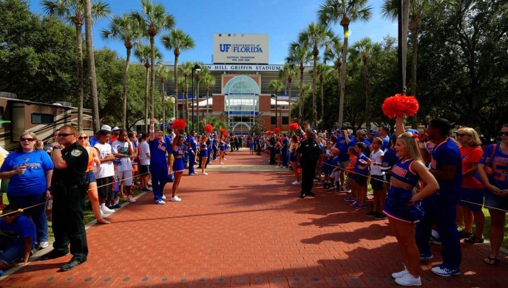 The Florida Gators march into Ben Hill Griffin Stadium greeting the Florida fans before the start of the game versus the Idaho Vandals. Florida Gators vs Idaho Vandals. August 30th, 2014. Gator Country photo by David Bowie.