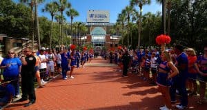 The Florida Gators march into Ben Hill Griffin Stadium greeting the Florida fans before the start of the game versus the Idaho Vandals. Florida Gators vs Idaho Vandals. August 30th, 2014. Gator Country photo by David Bowie.