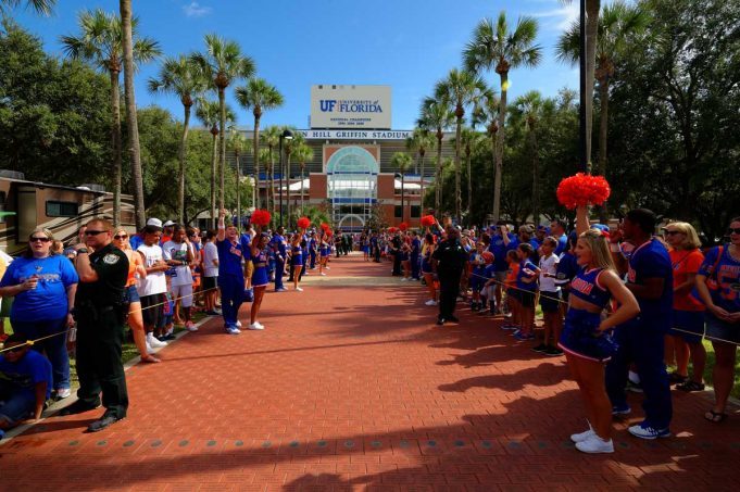 The Florida Gators march into Ben Hill Griffin Stadium greeting the Florida fans before the start of the game versus the Idaho Vandals. Florida Gators vs Idaho Vandals. August 30th, 2014. Gator Country photo by David Bowie.