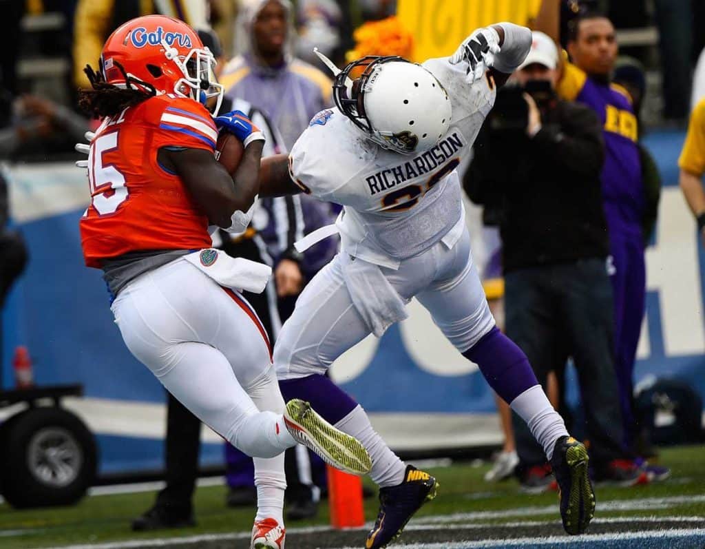 Jan 3, 2015; Birmingham, AL, USA; Florida Gators running back Brandon Powell (15) makes a touchdown catch against East Carolina Pirates defensive back Terrell Richardson (22) during the second quarter of the 2015 Birmingham Bowl at Legion Field. Mandatory Credit: Mike DiNovo-USA TODAY Sports