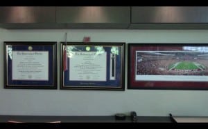 The office wall in the Sabin's house shows their mixed allegiances. 