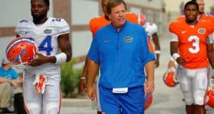 University of Florida head football coach Jim McElwain walks out to fall practice on August 27 - Florida Gators football - 1280x852