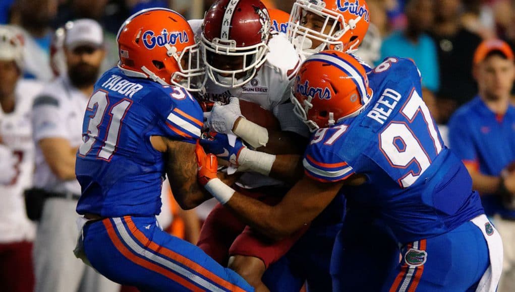 Florida Gators cornerback Jalen Tabor and defensive Justus Reed combine on a tackle against New Mexico State in 2015- 1280x853