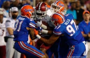 Florida Gators cornerback Jalen Tabor and defensive Justus Reed combine on a tackle against New Mexico State in 2015- 1280x853