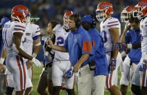 Florida Gators head coach Jim McElwain meets with his team during the Gators win over Kentucky- 1280x853