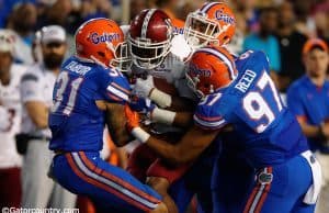 Sophomores Jalen Tabor and Quincy Wilson join redshirt freshman Justus Reed on a tackle in Florida's 61-13 win over New Mexico State- Florida Gators Football- 1280x852