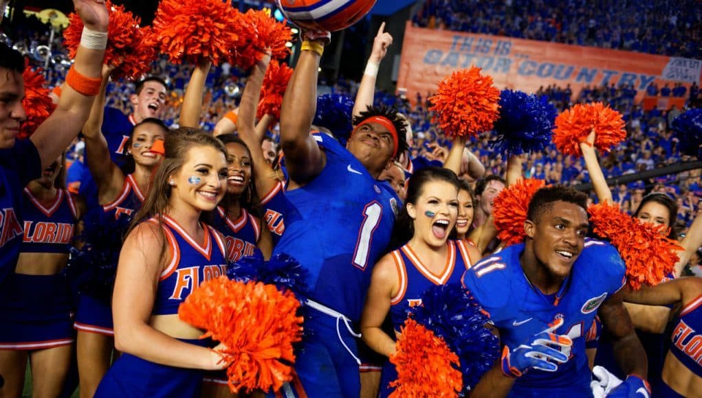 Juniors Vernon Hargreaves III and Demarcus Robinson celebrate with cheerleaders following the Florida Gators 28-27 win over the Tennessee Volunteers- Florida Gators football- 1280x854
