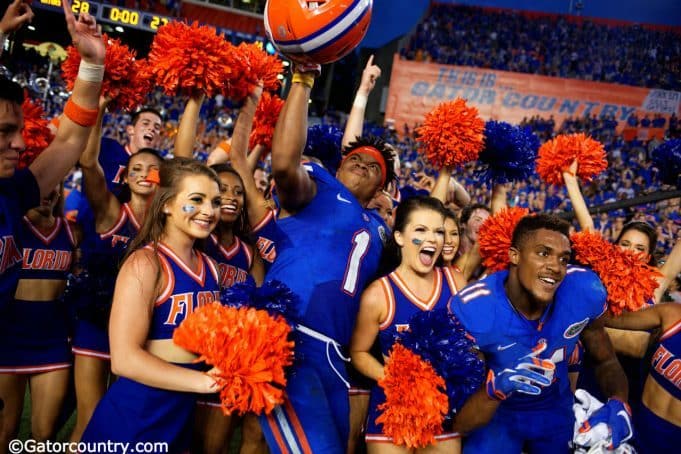 Juniors Vernon Hargreaves III and Demarcus Robinson celebrate with cheerleaders following the Florida Gators 28-27 win over the Tennessee Volunteers- Florida Gators football- 1280x854
