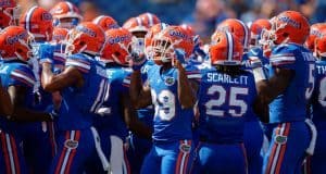 The Florida Gators huddle up before their contest against the Tennessee Volunteers- Florida Gators football- 1280x852