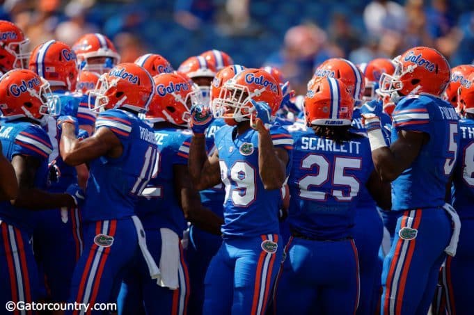 The Florida Gators huddle up before their contest against the Tennessee Volunteers- Florida Gators football- 1280x852