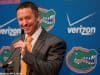 University of Florida head basketball coach Mike White at the podium for his first Florida Gators basketball media day appearence- Florida Gators basketball- 1280x852