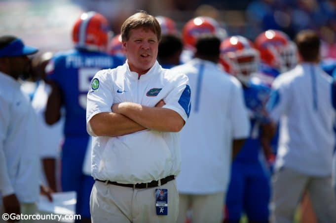 University of Florida head coach Jim McElwain observes his football team warming up before their game agianst Tennesse- Florida Gators football- 1280x852