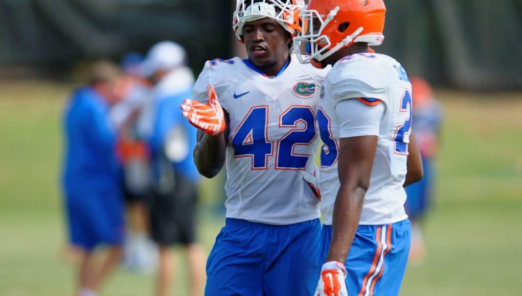 University of Florida junior safety Keanu Neal helps a teammate during fall camp- Florida Gators football- 1280x852