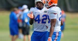 University of Florida junior safety Keanu Neal helps a teammate during fall camp- Florida Gators football- 1280x852