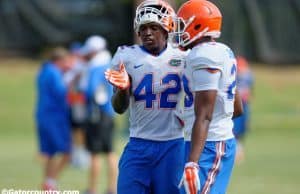 University of Florida junior safety Keanu Neal helps a teammate during fall camp- Florida Gators football- 1280x852