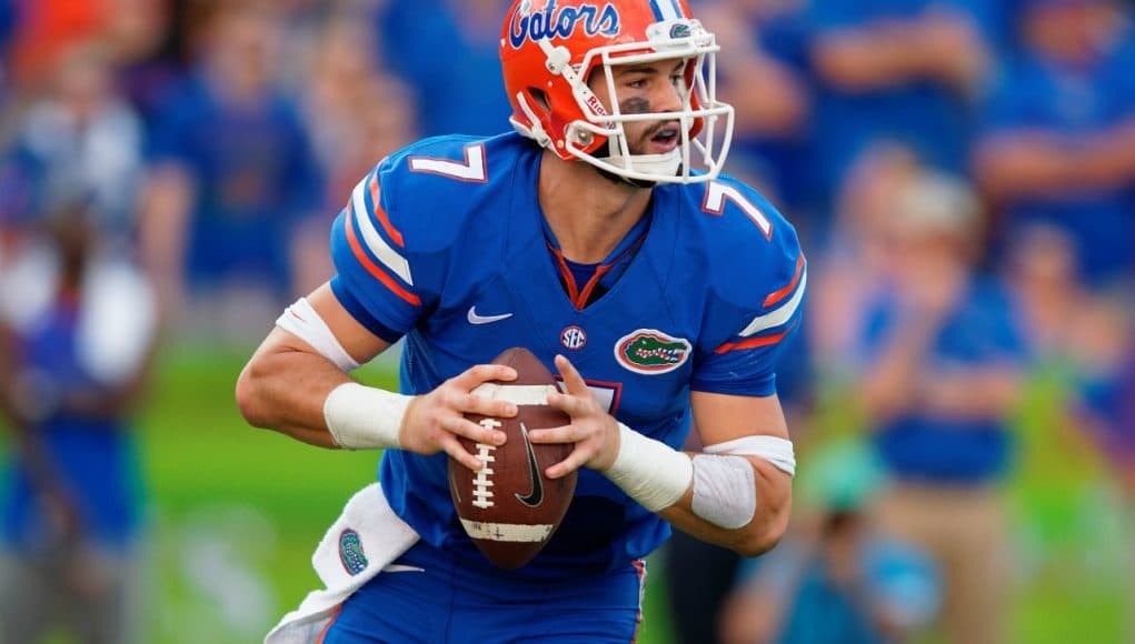 University of Florida quarterback Will Grier scrambles and looks for a receiver down field- Florida Gators football- 1280x852