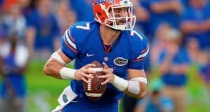University of Florida quarterback Will Grier scrambles and looks for a receiver down field- Florida Gators football- 1280x852