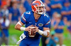 University of Florida quarterback Will Grier scrambles and looks for a receiver down field- Florida Gators football- 1280x852