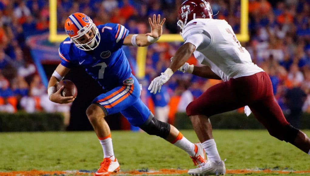 University-of-Florida-quarterback-Will-Grier-stiff-arms-a-defender-in-the-Florida-Gators-opening-game-Florida-Gators-Football-1280x851