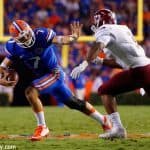 University-of-Florida-quarterback-Will-Grier-stiff-arms-a-defender-in-the-Florida-Gators-opening-game-Florida-Gators-Football-1280x851