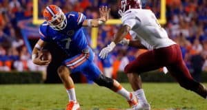 University-of-Florida-quarterback-Will-Grier-stiff-arms-a-defender-in-the-Florida-Gators-opening-game-Florida-Gators-Football-1280x851