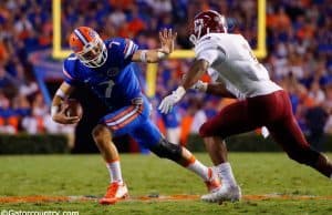 University-of-Florida-quarterback-Will-Grier-stiff-arms-a-defender-in-the-Florida-Gators-opening-game-Florida-Gators-Football-1280x851