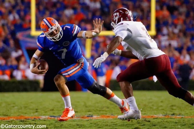University-of-Florida-quarterback-Will-Grier-stiff-arms-a-defender-in-the-Florida-Gators-opening-game-Florida-Gators-Football-1280x851