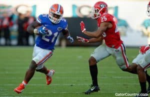 Florida Gators running back Kelvin Taylor runs for a first down against Georgia in 2015- 1280x852