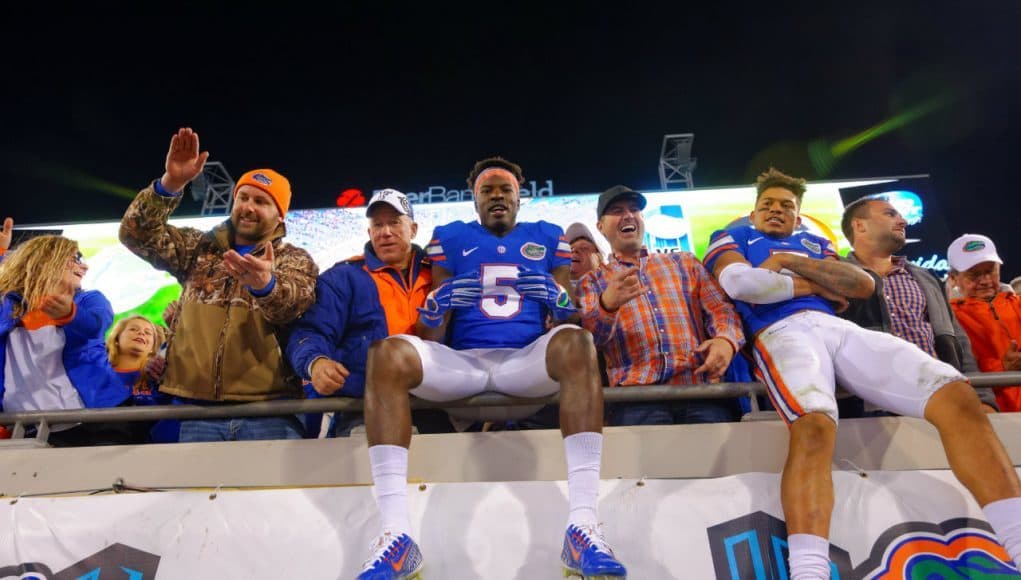 Jacksonville native Ahmad Fulwood celebrates with Jalen Tabor after the Florida Gators win over Georgia in 2014- Florida Gators football- 1280x852