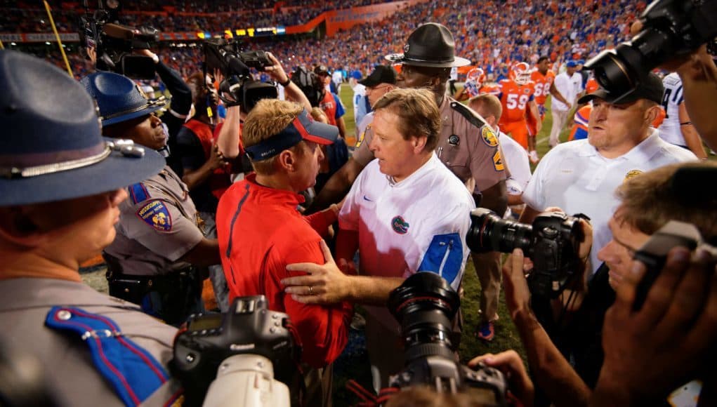 University of Florida head coach Jim McElwian greets Ole Miss head coach Hugh Freeze after Florida's 38-10 win over the Rebels- Florida Gators football- 1280x854