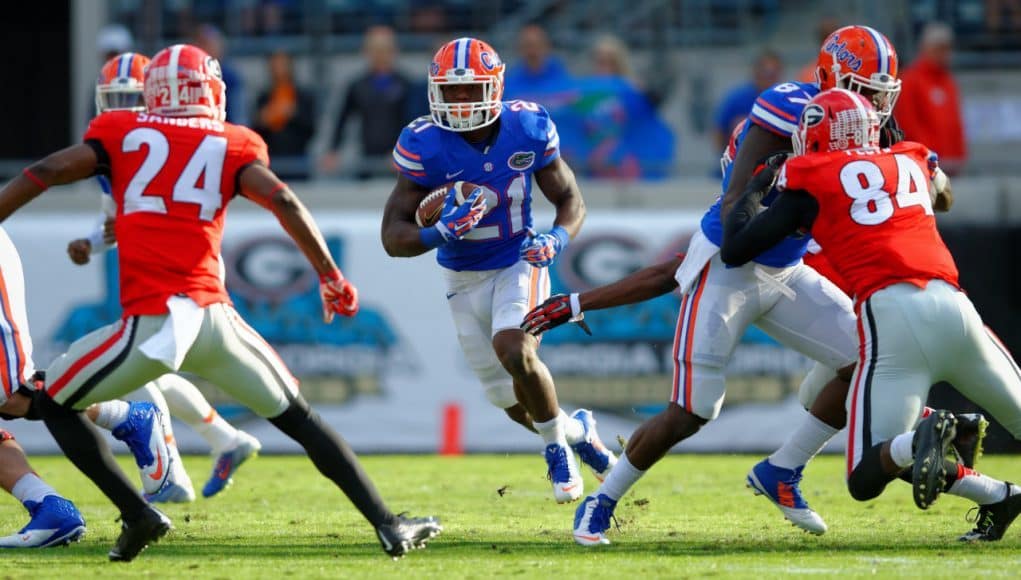 University of Florida running back Kelvin Taylor carries the ball against the Georgia Bulldogs in 2014- Florida Gators football- 1280x852