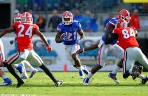 University of Florida running back Kelvin Taylor carries the ball against the Georgia Bulldogs in 2014- Florida Gators football- 1280x852