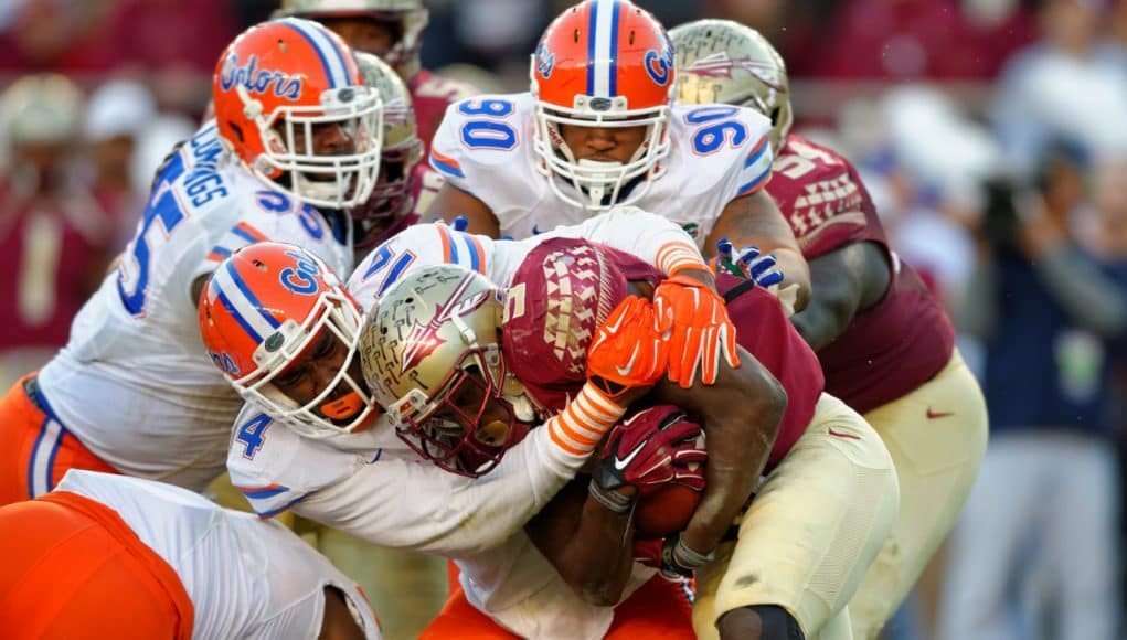 Alex McCalister and Jon Bullard combine to tackle Florida State Seminole running back Dalvin Cook- Florida Gators football- 1280x852