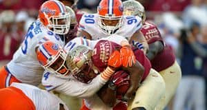 Alex McCalister and Jon Bullard combine to tackle Florida State Seminole running back Dalvin Cook- Florida Gators football- 1280x852