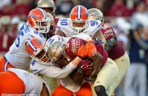 Alex McCalister and Jon Bullard combine to tackle Florida State Seminole running back Dalvin Cook- Florida Gators football- 1280x852