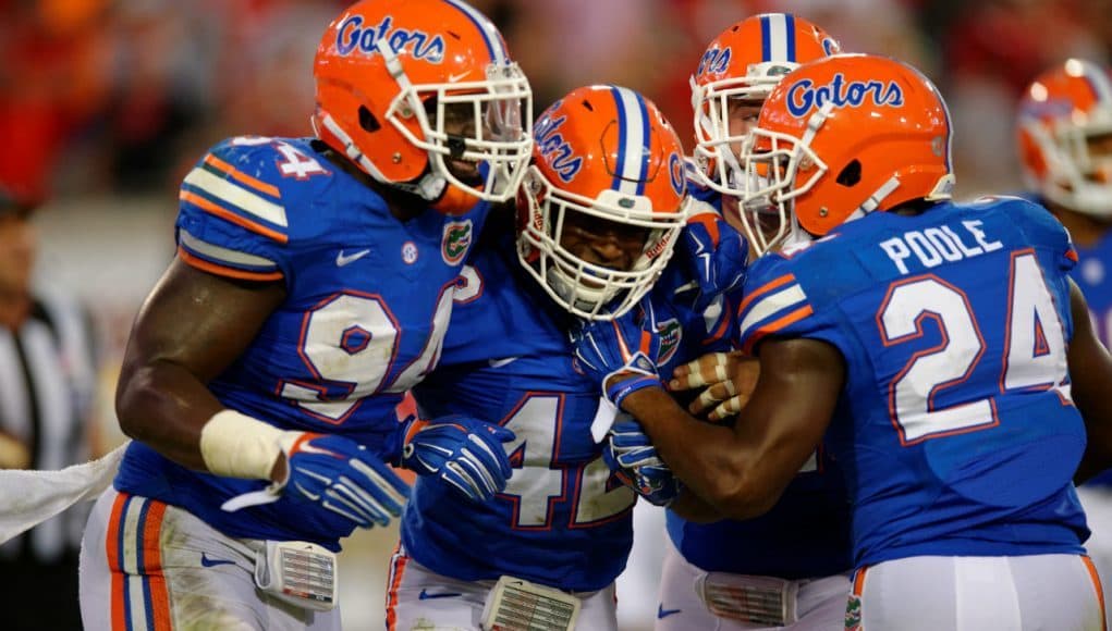 Florida Gators defensive players celebrate Keanu Neal's interception- 1280x852