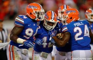Florida Gators defensive players celebrate Keanu Neal's interception- 1280x852