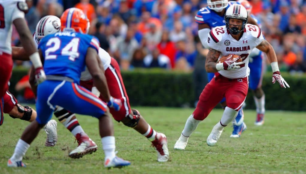 South Carolina running back Brandon Wilds runs against the Florida Gators in 2014- Florida Gators football- 1280x852