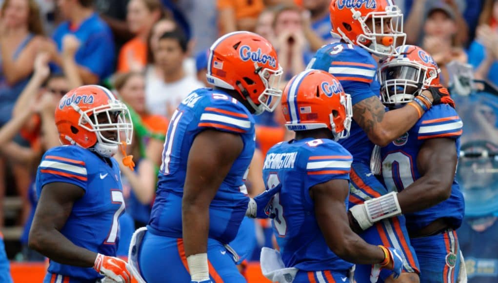 University of Florida defensive players celebrate a big tackle by Jarrad Davis against the FAU Owls- Florida Gators football- 1280x852