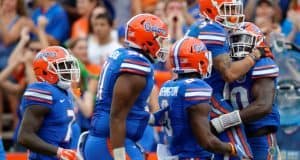 University of Florida defensive players celebrate a big tackle by Jarrad Davis against the FAU Owls- Florida Gators football- 1280x852
