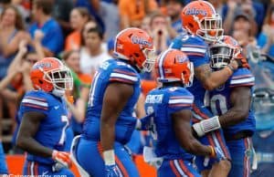 University of Florida defensive players celebrate a big tackle by Jarrad Davis against the FAU Owls- Florida Gators football- 1280x852