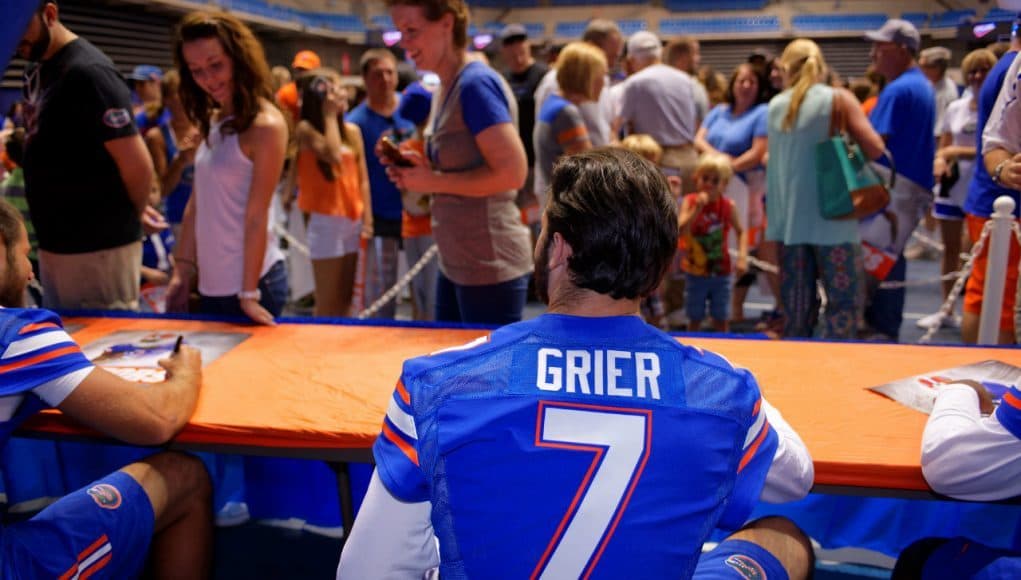 University of Florida redshirt freshman quarterback Will Grier signs autographs for fans during Florida Gators football fan day- Florida Gators football- 1280x854