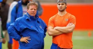Florida Gators head coach Jim McElwain and redshirt freshman quarterback Will Grier watch high school athletes work out during Friday Night Lights- Florida Gators football- 1280x854