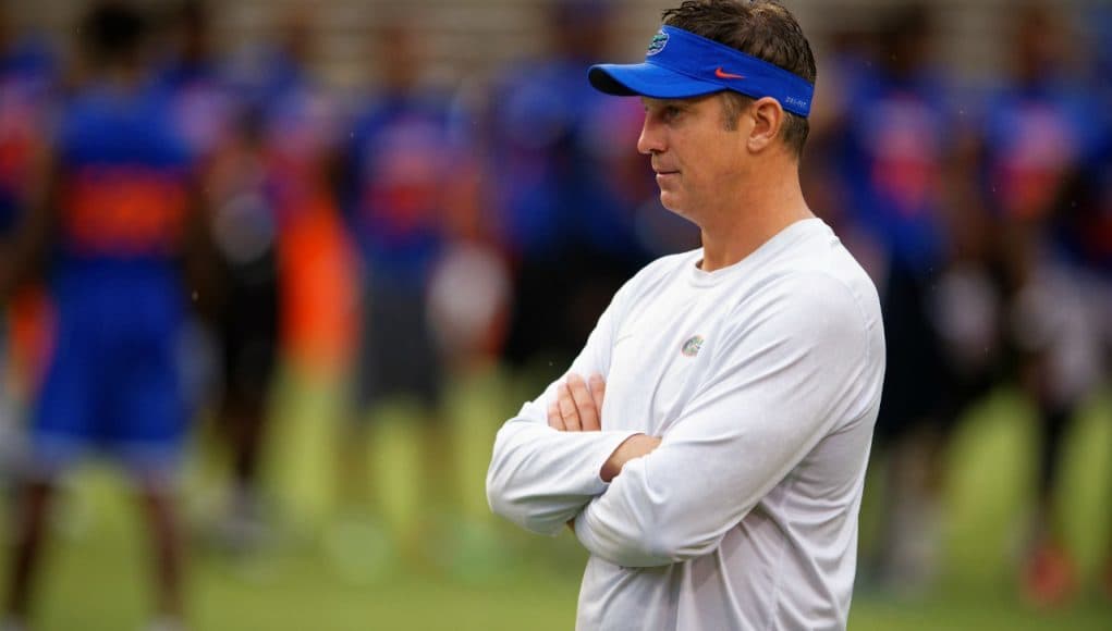 Florida Gators offensive coordinator Doug Nussmeier watches prospects work out during Friday Night Lights- Florida Gators football- 1280x854