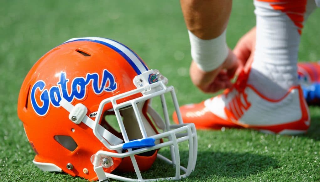 A Florida Gators player ties his shoe before the Buffalo Wild Wings Citrus Bowl- Florida Gators football- 1280x852